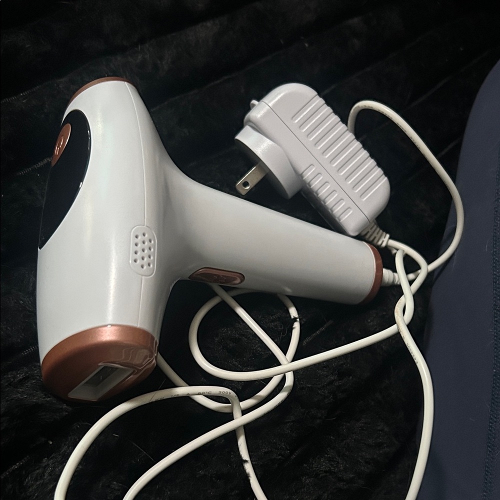 White and Copper Hair Removal Device